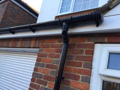Black guttering and downpipe installation