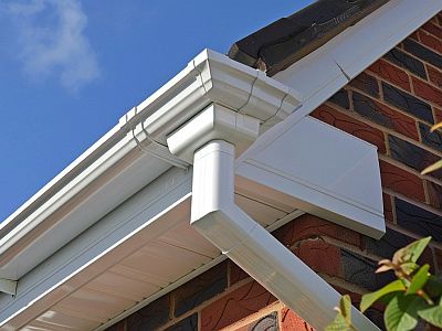White guttering fascia soffit and downpipe roofline installation